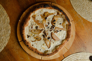 Pizza bianca on wooden table - obrazy, fototapety, plakaty