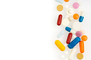 Set of different colorful pills and capsules isolated on white background. Copy space for text.