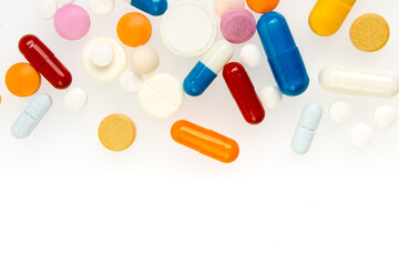 Set of different colorful pills and capsules isolated on white background. Copy space for text.