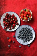 Still life photo with seasonal fruit. Colorful picture of summer fruit on a table. 
