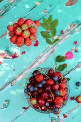 Simple composition still life photo with fresh berries. Seasonal fruit close up photo. Eating healthy concept. 