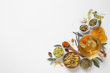 Freshly brewed tea and dried herbs on white background, top view. Space for text