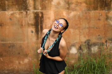 Latin Urban Playful Girl Smiling Playing with her Hair