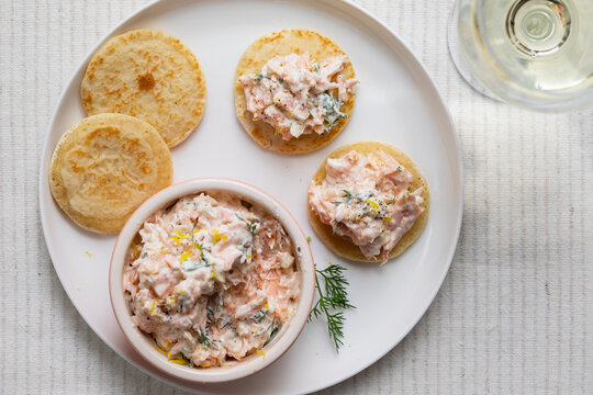 Party canapes, blinis with salmon spread