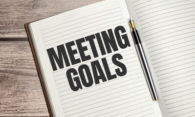 MEETING GOALS text on notepad with pen, business concept