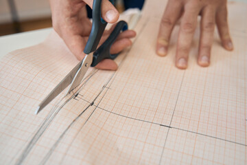 Dressmaker making patterns for sewing handmade clothes