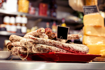 Italian food market with pepperoni and cheese, salsicella dolce, Tuscan delicatessen stall display,...
