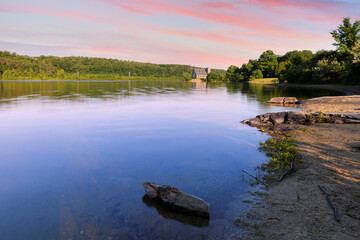 The Old Stone Church and Wachusett Reservoir at West Boylston at sunrise, Massachusetts.  The Church, built in 1891, is a historic building in Boylston and is a National Resisted Historic Place. 