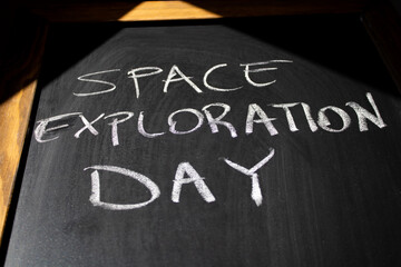 Fototapeta premium Space Exploration Day is on the chalkboard