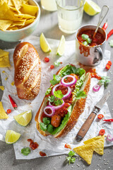 Hot barbecue hot dogs with grilled sausage and sauce.