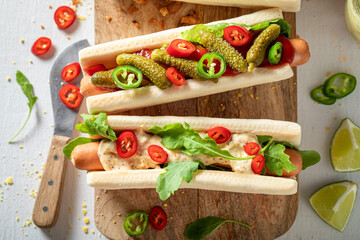 Unhealthy and tasty hot dogs as appetizers for summer party.