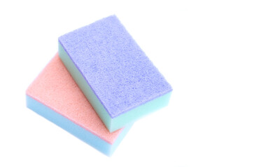 Colorful cleaning sponges for scrubbing dishes or other purposes on white background. Concept : household washing tools, equipment in kitchen.