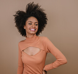 Closeup of a smiling young Latin afro woman. Joy, positive and love. Beautiful african-style hair....