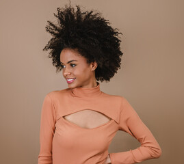Closeup of a smiling young Latin afro woman. Joy, positive and love. Beautiful african-style hair....