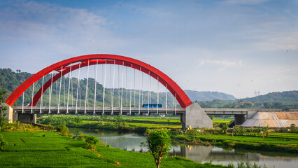 Fototapeta na wymiar Swing arch bridge construction. bridge with the blue sky background. Arch bridge. Kalikuto Bridge