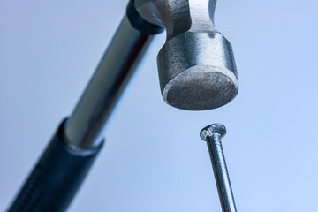 Hammer and nail head macro 