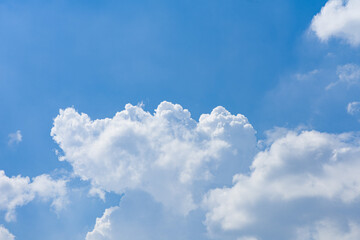 Naklejka na ściany i meble White and fluffy clouds on a blue sky