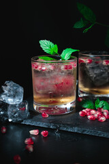 Two summer cocktails with pomgranate and mint