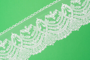 White laces on green background isolated diagonally