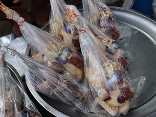 Fresh chicken ready for cooking is sold in the fresh market.