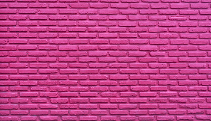 Fototapeta na wymiar Pink brick wall abstract background. Pink rough brick wall texture. Background for love and Valentine's day. Brick wall wallpaper with copy space. Interior or exterior architecture design for lady.