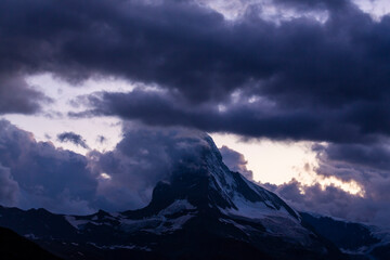 Plakat Beautiful storm cloudscape in the Swiss Alps in summer, with Matterhorn peak in the background