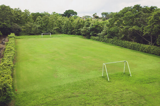 Aerial photo of the soccer field. Green grass. Concept of sport and background.