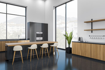 Modern cooking interior with countertop and seats, shelves and kitchenware, window