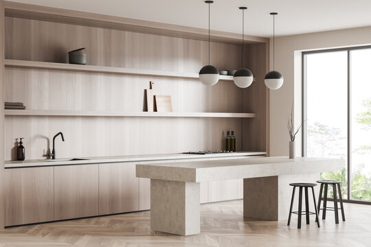 Light kitchen interior with seats and table, kitchenware and panoramic window