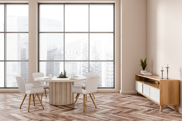 Light dining room interior with chairs and drawer, panoramic window