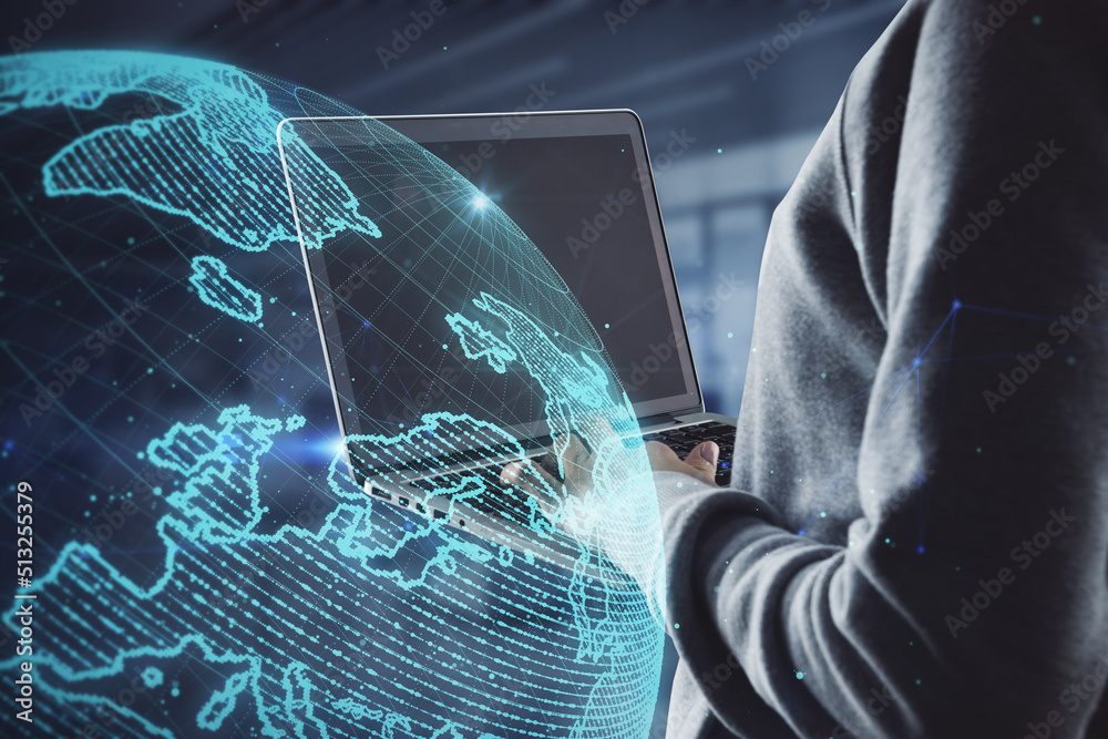Poster hacker hands using laptop computer with creative glowing polygonal grid planet on blurry office interior background. 