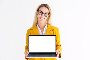 Portrait of young Caucasian blond woman in jacket with laptop on white background. Beautiful female...