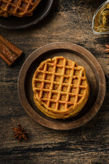pumpkin waffles on a dark wooden background
