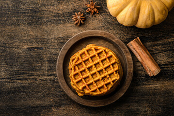 pumpkin waffles on a dark wooden background