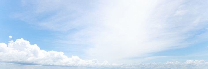 Beautiful clear blue sky background with tiny plain white cloud on morning time rays sunlight. space for text. soft focus.