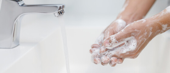 Hygiene. Cleaning Hands. Washing hands with soap under the faucet with water Pay dirt.