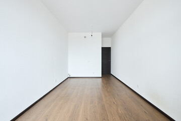 Interior of new apartment without finishing in gray tones