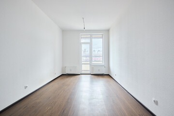 Interior of new apartment without finishing in gray tones