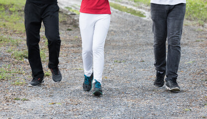 Closeup of legs while running in the park.