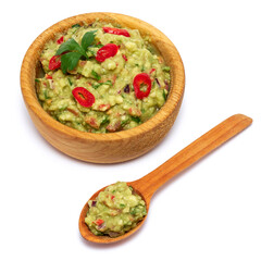 Wooden bowl of guacamole dip sauce isolated on white background