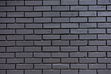 Mur de briques peintes en noir