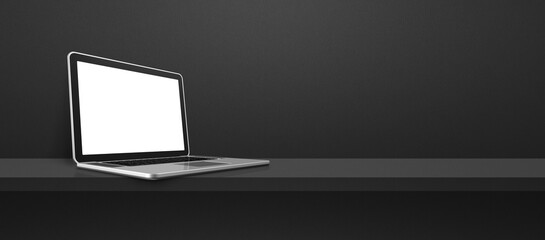 Laptop computer on black shelf background banner