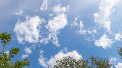 Fototapeta premium Close up shot of a beautiful blue sky with a few clouds