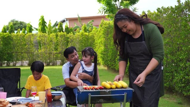 A young family with preschool children enjoying a weekend of cooking.