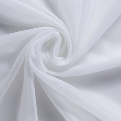 Naklejka na ściany i meble texture of a thin transparent white fabric for curtains, with folds twisted towards the center