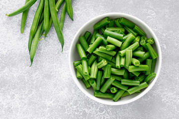 Fresh raw green beans cut in a bowl. French green beans
