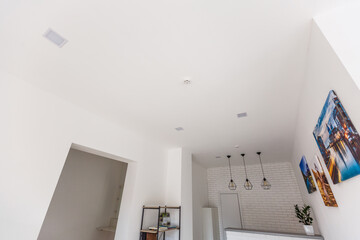 White ceiling with spot lights in room