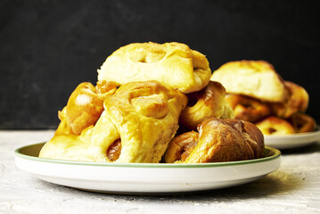 freshly baked homemade cakes with jam on a plate on the table close-up