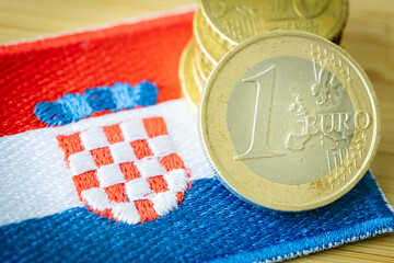 Croatian flag next to the single currency of the European Union, Concept of Croatia joining the...