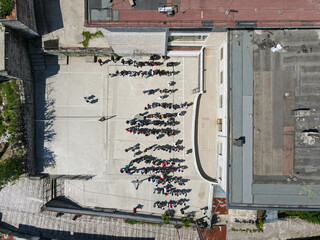 Drone view at the school yard of Gjirokastra in Albania